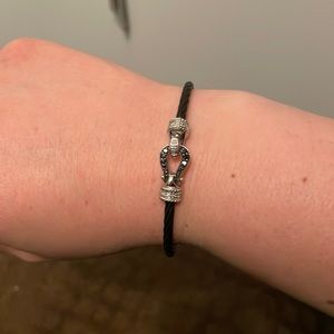 Black rope bracelet with black stones and silver finishings
